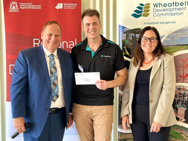 Tradesales Marketing Manager recieving RED Grant from Don Punch MLA